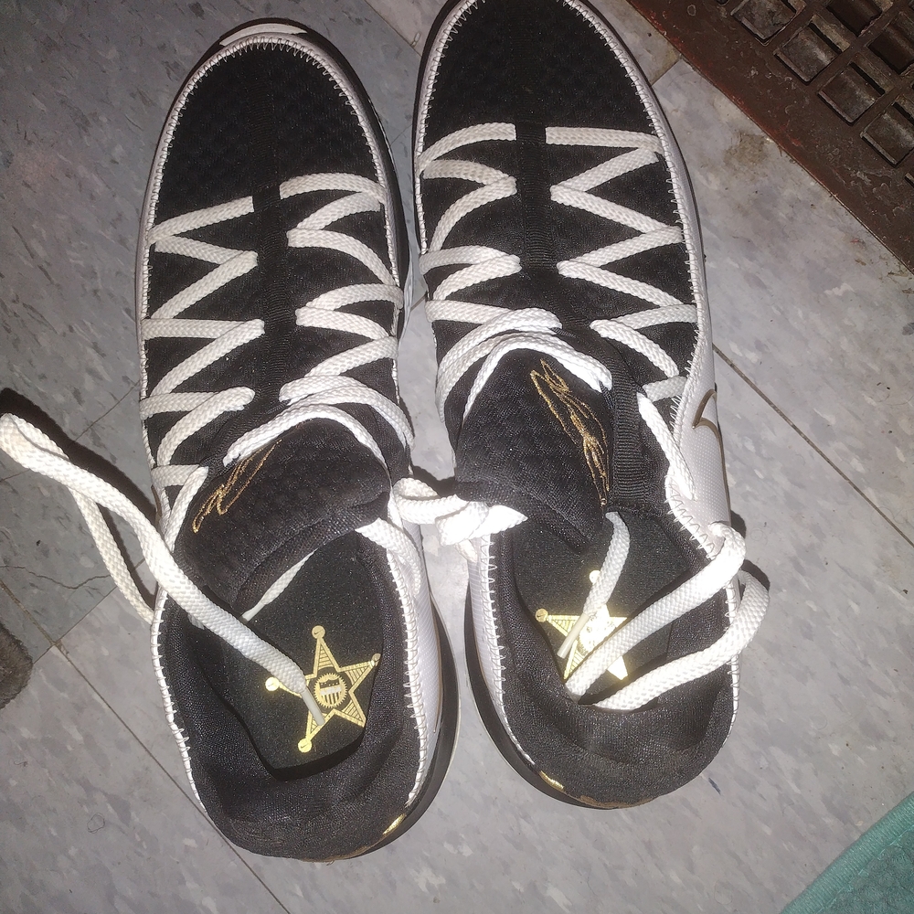 Nike Black and White Sneakers with Gold Accents